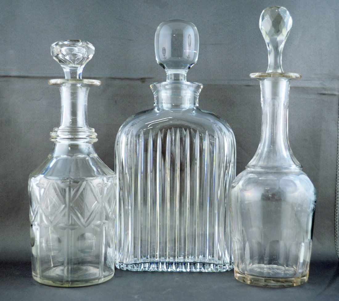 2 Hand Blown liquor Decanters & A Crystal Flask: Two hand blown liquor decanters and one crystal flask. Decanters measure 10" and 8.5" H. and Flask measures 10" H.