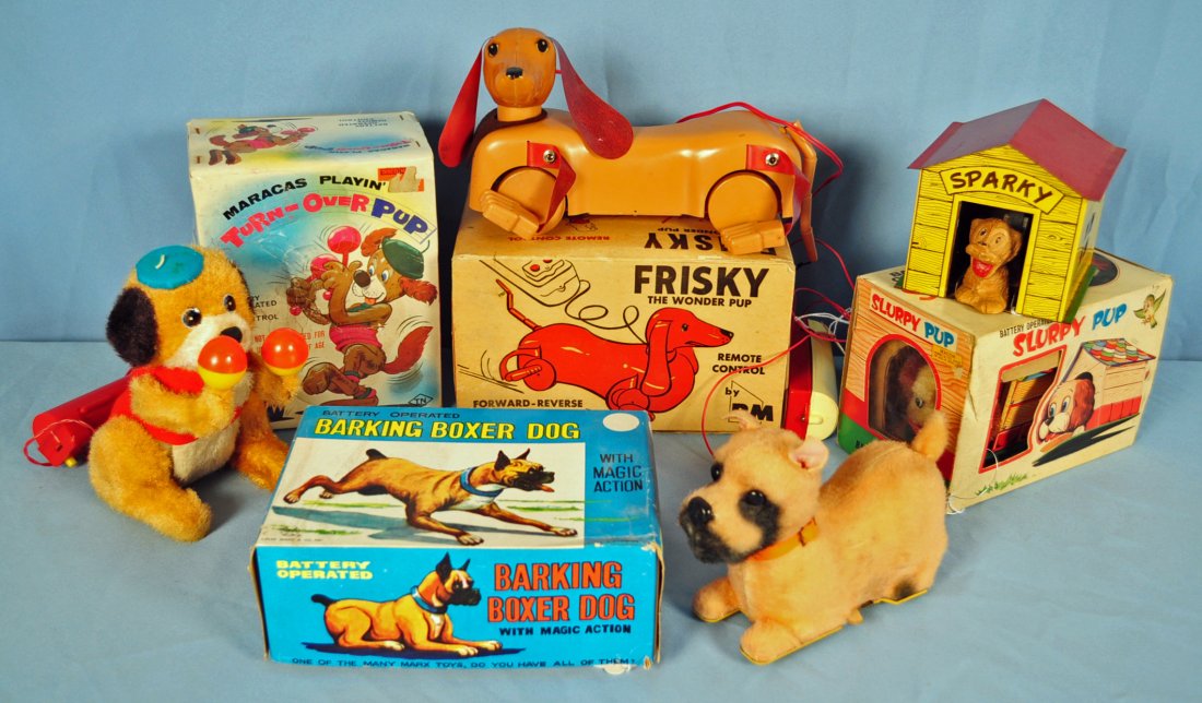 5 Battery Operated 1950's Toy Dogs: 5 Battery Operated Toy Dogs Includes Frisky the Wonder Pup, Barking Boxer Dog, Maracas Playin' Turn-over Pup, and Slurpy Pup - in original boxes. Includes Sparky without box. Condition - when tested,