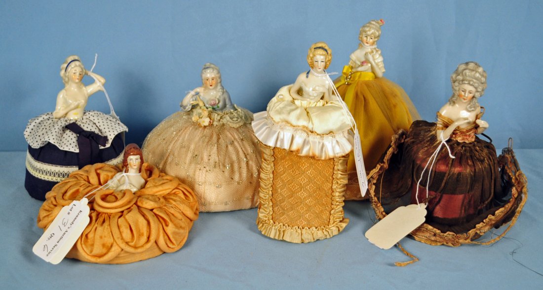 Six 18th C. Style Lady, Half Doll Pin Cushions: Six 18th Century Style Porcelain Lady, Half Doll Pin Cushions. Circa first half of 20th Century. Heights range from 3.5" to 8". Condition - all dolls in good condition. Cushions vary in condition from