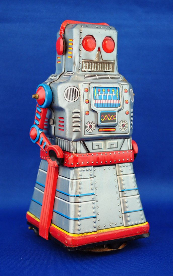 Yoshiya ATOM Robot Tin Toy: Yoshiya ATOM Robot Tin Toy Wind-up friction robot, circa 1950's. 6.5" tall. Condition - working when tested. Minor scratches, slight surface rust on one shoulder and on top of head. See photos for mor