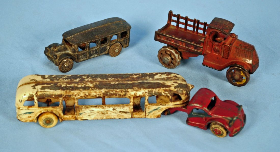 3 Cast Iron Toys Circa 1902's - 1930's: 3 Cast Iron Toys Circa 1902's - 1930's Includes: 1933 Arcade Chicago Century of Progress Greyhound Bus, 10.25" long. Cast iron bus circa 1920, 4" long. Cast iron delivery truck circa 1915, 5.5" long. 