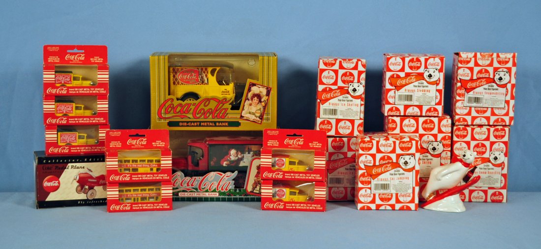17 Coca Cola Collectible Items New in Boxes: Seventeen Coca Cola Collectible Items New in Boxes. Two Die Cast Truck Banks, Seven matchbox car size vehicles, Mini pedal airplane, Seven Enesco1995 Polar Bear Ceramic Figures. Condition- all items a