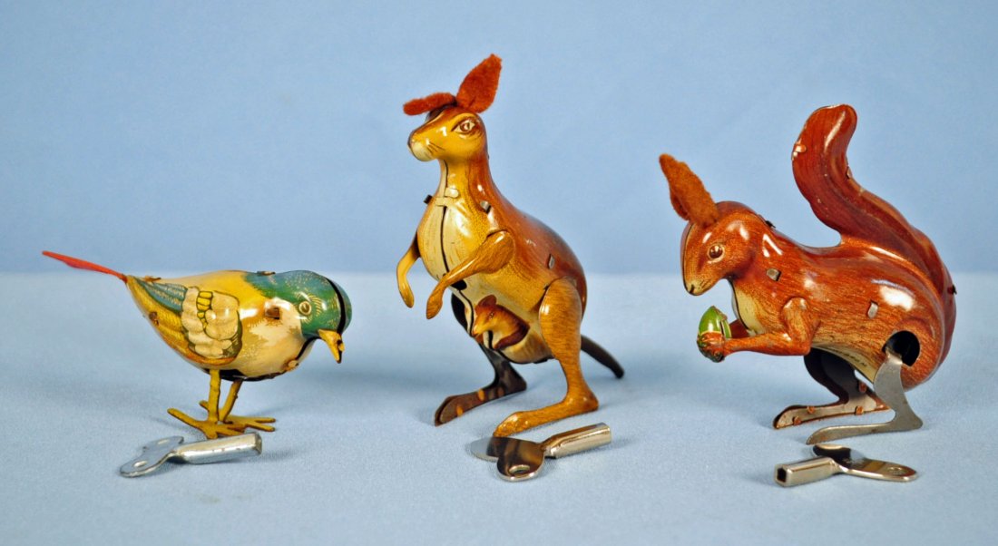 3 Lithographed Tin Clockwork German Toys 1940`s: Three Lithographed Tin Clockwork German Toys 1940`s. Koehler made in the U.S. Zone Germany Squirrel 3.25" High. Unmarked Koehler made in the U.S. Zone Germany Kangaroo 3.25" High. Koehler made in Germ