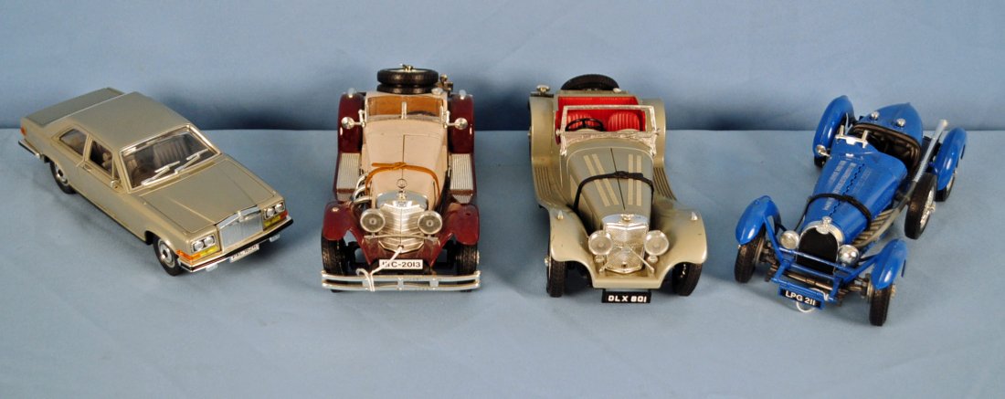 Four Burago 1/22 Scale Automobiles: Four Burago Scale Automobiles. Rolls Royce Camargue 1/22, 1937 Jaguar SS 100 in 1/18 scale, 1928 Mercedes SSK 1/18 scale, 1934 Bugatti Type 59 in 1/18 scale. Condition All are in good condition. 1928 