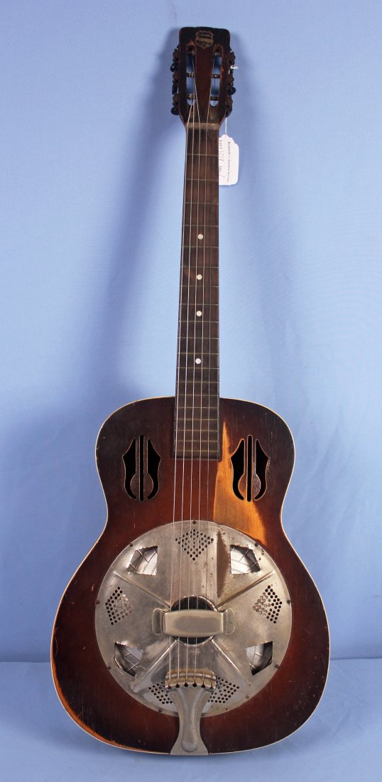 National Rosita Dobro-Style Resonator Guitar: Vintage Rosita Dobro-style resonator guitar. Guitar measures 38.5" Long X 3.75" Thick and Body 14" X 18" - Condition: Resonator cover has four irregular diamond-shaped cutouts by former owner for pref