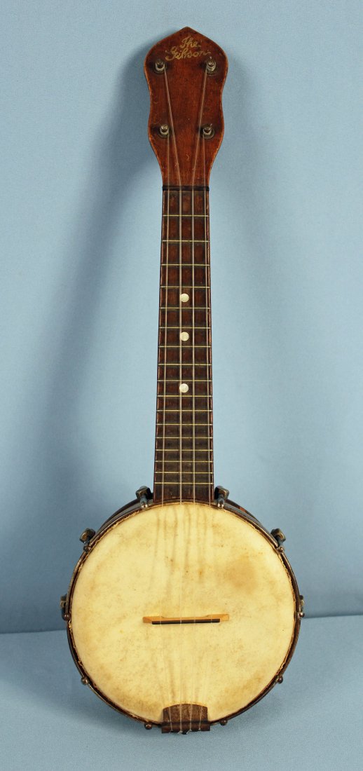 1920-30s Gibson UB-1?: Vintage Gibson UB-1? ukulele banjo. Overall length of approx. 19.5" and body diameter of approx. 6". - Condition: Chrome shows surface rusting. Some scratches, dents, and finish loss. One small chip t