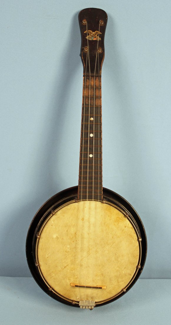 Antique Republic Banjo Uke w/ Resonator: Antique Republic banjo uke with resonator. Measures 21.5" long X 8.75" dia. X 3" thick. - Condition: Brass resonator has losses. Head has staining. Other general wear - See photos for more details.