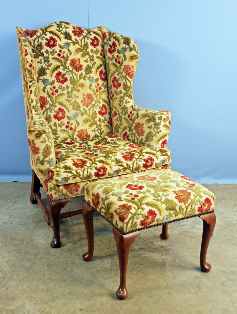 Kittinger Williamsburg Wingback Chair & Stool: Kittinger CW Williamsburg solid mahogany wingback chair in a floral-cut velvet upholstery and matching stool. Both the chair and stool has the Williamsburg Collection CW brand on the interior of the r
