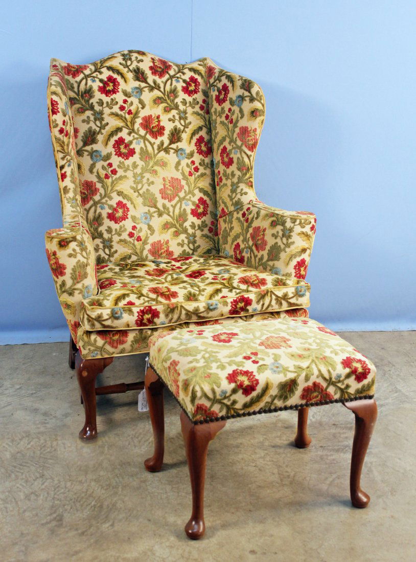 Kittinger Williamsburg Wingback Chair & Stool: Kittinger CW Williamsburg solid mahogany wingback chair in a floral-cut velvet upholstery and matching stool. Both the chair and stool has the Williamsburg Collection CW brand on the interior of the r