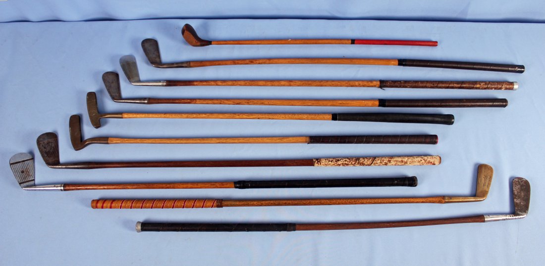 Group of 9 Golf Clubs w/ Wooden Shafts: Group of nine golf clubs with wooden shafts. Group includes the following: A vintage Wright & Ditson hickory shaft St. Andrews putter circa 1910; A first Flight putter; A Burrbilt mid-iron; A Royal mi