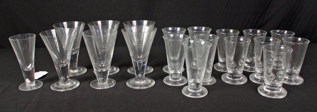 19 Williamsburg Style Goblet & Liquor Glasses: Group of 19 handmade Williamsburg style water goblets and liquor glasses. Water goblets measure 6.25" high. Smallest liquor glass measures 5". Some have etched signature "MB" on base.