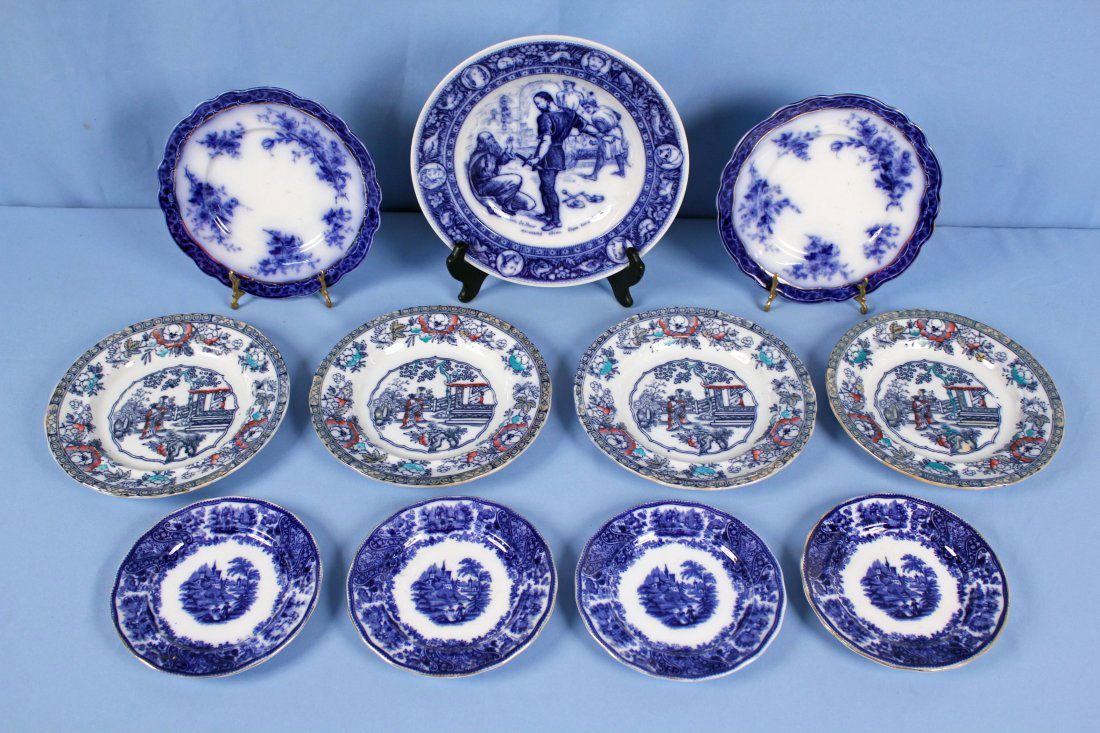11 Flow Blue Plates & Saucers: 11 Flow Blue plates & saucers. Four Adams Chinese Ching Pattern England dinner plates, measuring 10.25". One Wedgewood Ivanhoe Flow blue dinner plate Front de Boeuf with Isaac the Jew, measuring 10.37
