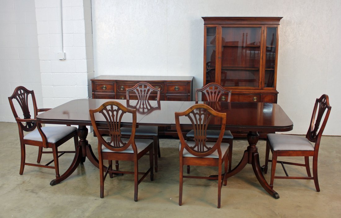 9 Pcs Mahogany Duncan Phyfe Style Dinning Suit: 9 pieces mahogany Duncan Phyfe style dinning room suit. Suit includes: Breakfront china cabinet, buffet, six shield back chairs with blue covers, and a double pedestal table with two leaves. Table mea