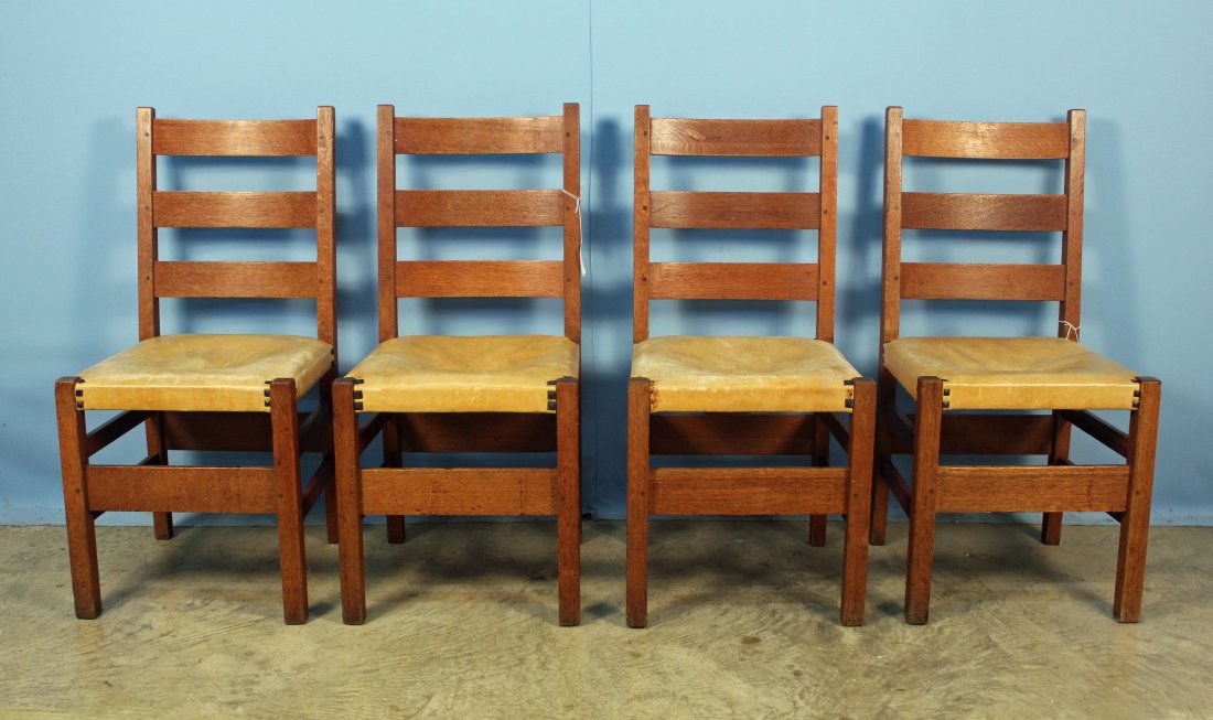 4 Gustav Stickley No. 306 1/2 Ladder Back Chairs: Four Gustav Stickley No. 306 1/2 ladder back oak chairs. Bottoms of chairs are replaced leather. The chairs are peg constructed with original Stickley tacks. All chairs have original labels under seat