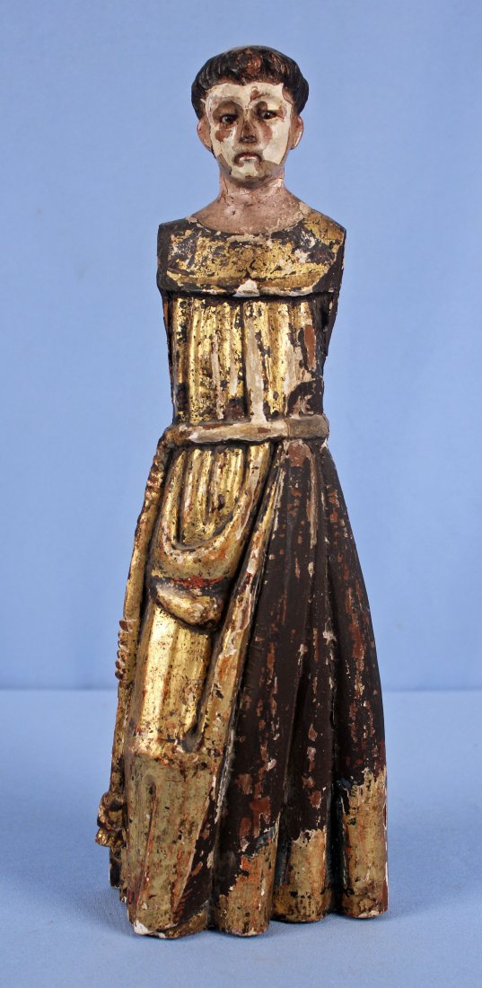 18th/19th C. Giltwood Santos Figure of St. Anthony: 18th -19th Century hand carved giltwood and polychromed wood St. Anthony, Santos figure in robe. The Santos has hand blown glass eyes and is 15.25" H. X 5.25" wide at base.