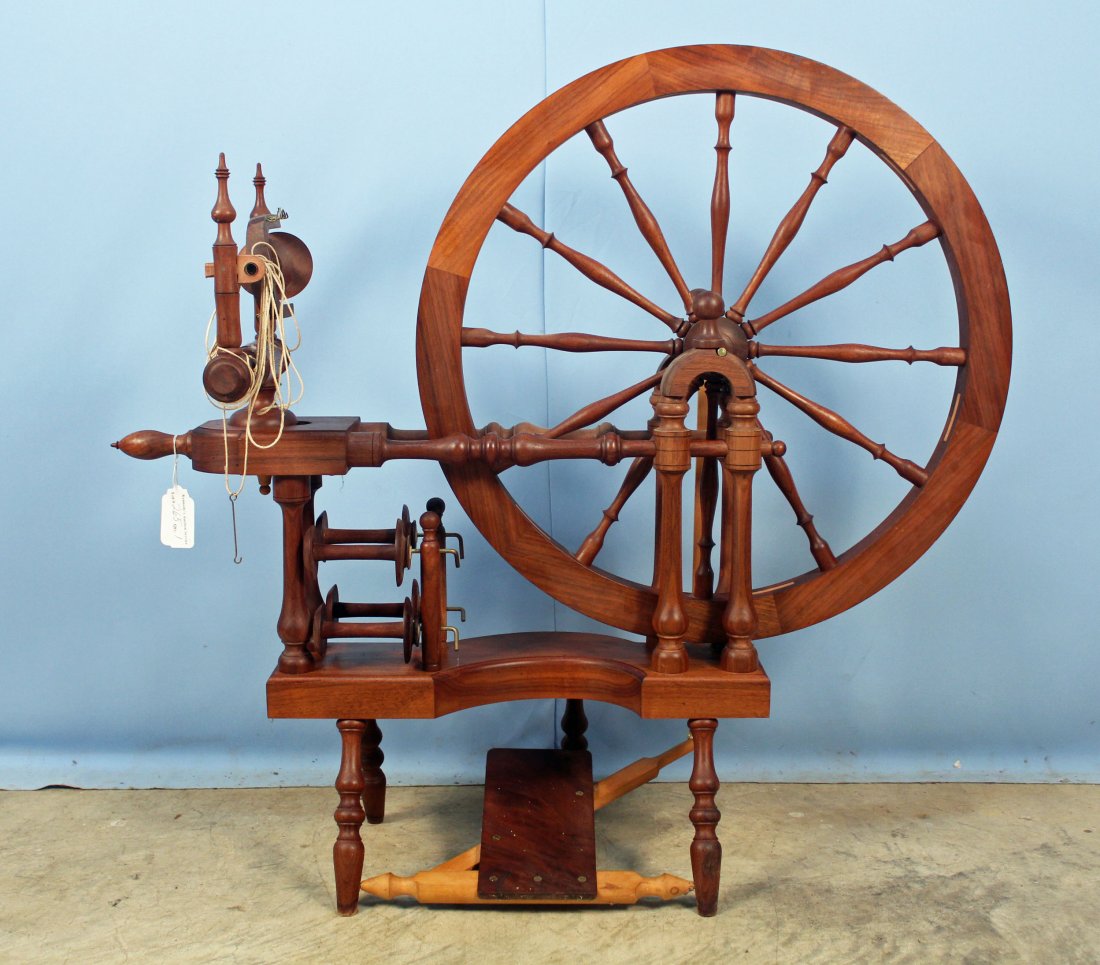Norwegian Style Spinning Wheel by Michael Wilson: Norwegian Style "Belle Fleur" Walnut Spinning Wheel by Michael Wilson. Wilson Wood Works, Berea, Kentucky. The beam is marked on the underside April, 1985 and number 427. Hardware, spindle and crank a