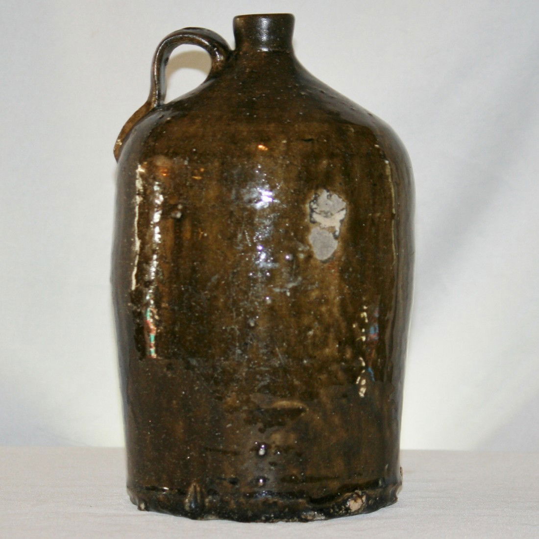 Crawford County 1 Gallon Jug: Signed R for Rudolphus Yaughn. Has a rare stamp of an R. Alkaline glaze. Artist Name: Rudolphus Yaughn