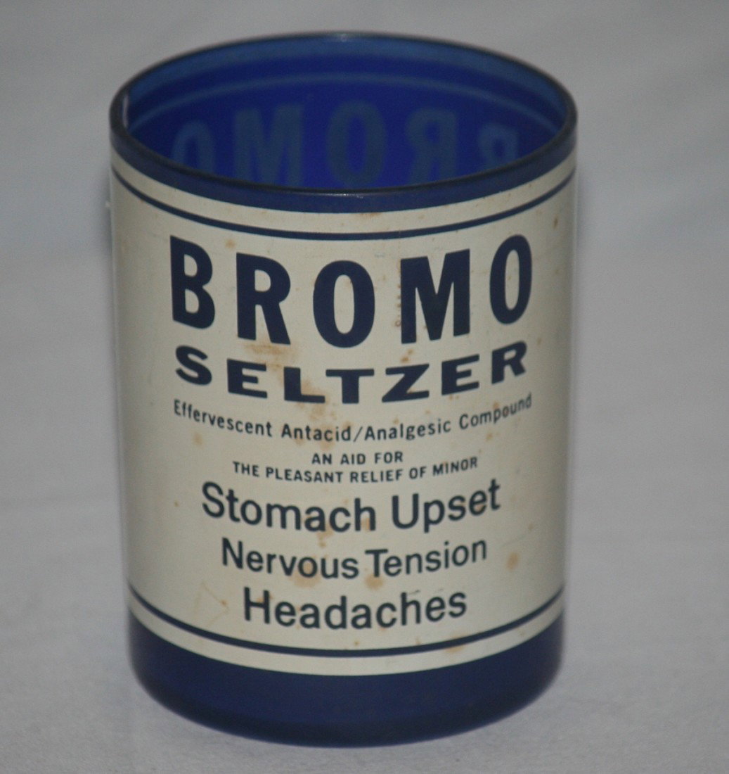 Bromo Seltzer Cobalt Glass: Cobalt glass cup with Bromo Seltzer information painted onto the glass. Circa: 1950's-1960's