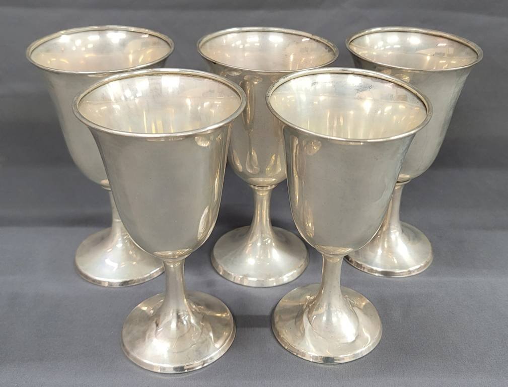 Five Sterling Silver Wine Goblets: Five Sterling Silver Wine Goblets all are marked International Sterling P 661.These are from the Atlanta estate and in like new condition. One has a small dent at base. Weighed on our scale and is as 
