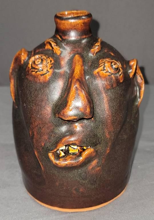 Fine Robert Brown Face Jug Arden NC: Fine Robert Brown (Late) Face Jug Arden North Carolina Circa Late 1970's to early 1980's, this is a fantastic example in southern stoneware. The piece is a rich dark brown glaze that the Brown family