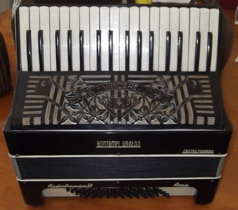 1939 WWII era Bontempi Ubaldo presentation Accordia: What a rare find here! This Accordian was made as a presentation piece for the Axis countries. It has the Nazi and Japanese flags on rifles and the Italian flag between the 2 rifles. With a banner abo