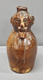 Norman Smith Alabama Political Stoneware Figural - Flask: Norman Smith (late) Alabama Political Stoneware Figural Flask. Quart size flask / jug. Outstanding slip glaze figural flask / jug with outstanding facial details and was noted to be made for Judge Irb