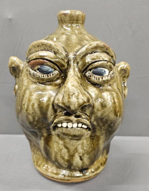 1988 Lanier Meaders Face Jug: 1988 Lanier Meaders (1917-98) Face Jug with a outstanding facial features. The face jug has a wonderful alkaline glaze and clay teeth. One of the more scarce examples due to having a date on the botto