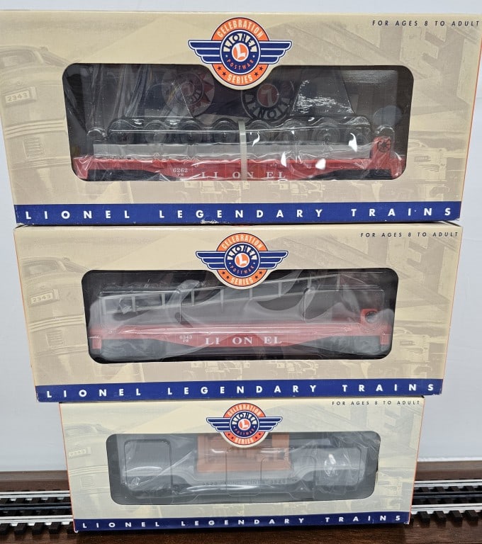 Lionel Post War Celebration Lot of Three (NIB): Lionel Post War Celebration Lot of Three (NIB) C-10 1- Lionel 6-26768 3520 Operating Searchlight Car 2- Lionel 6-19451 6262 Wheel Car