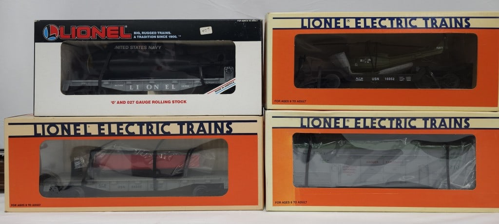 Lionel Flatcar and Missile Car Lot of Four (NIB): Lionel Flatcar and Missile Car Lot of Four (New In Box) All In C-10 Condition. Lionel Flatcar and Missile Car Lot of Four (New In Box) All In C-10 Condition. 1- Lionel Flatcar with Submarine 6-16351.