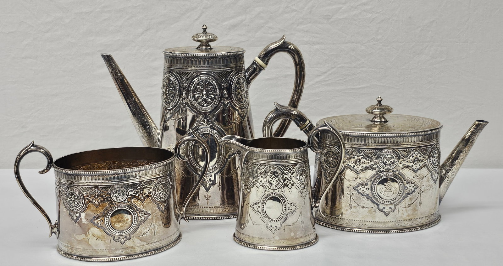 Hall & Co England Sterling Silver Coffee & Tea Set, 1810 Grams of Silver: Stunning Hall & Co. Manchester England Silver Coffee & Tea Service Set of Four pieces. All are properly hallmark with the Lion Passant within a shield. Stamped Hall & Co. Manchester with the letter "T