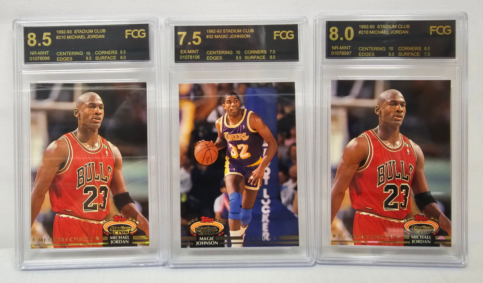 1992-93 Michael Jordan Stadium Club Card Lot: 1992-93 Michael Jordan Stadium Club Card Lot. FCG Graded. 1. 1992-93 Michael Jordan Stadium Club #210 x2 Grades - 8.5 & 8.0 2. 1992-93 Stadium Club #32 Majic Johnson 7.5 grade