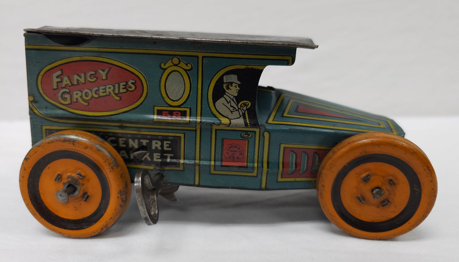 1927 J. Chein Fancy Groceries Tin Litho Windup Toy: 1927 J. Chein Fancy Groceries Tin Litho Windup Toy Truck, in very good working condition. 5 3/4 L