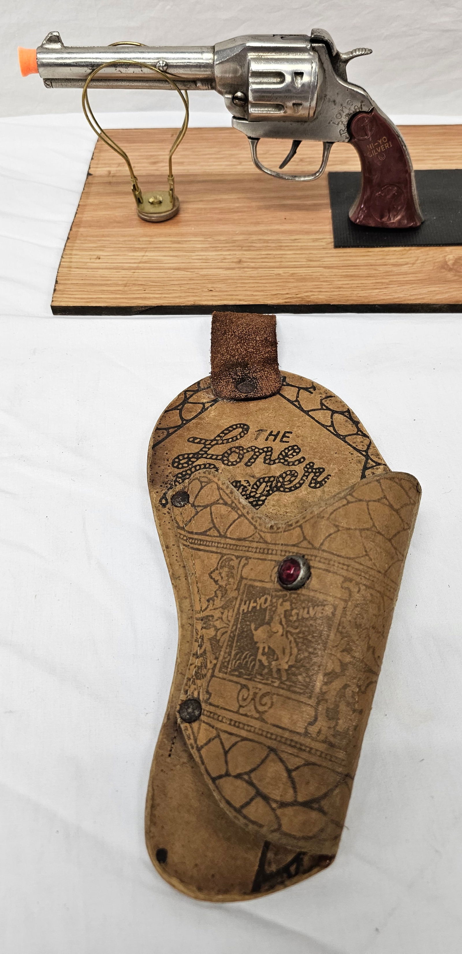 Lone Ranger Cap Gun W/Holster By Kilgore: Fine Lone Ranger Cap Gun With Holster, By Kilgore, the gun has a slight loose grip but in original intact condition. VG+ collector grade condition.