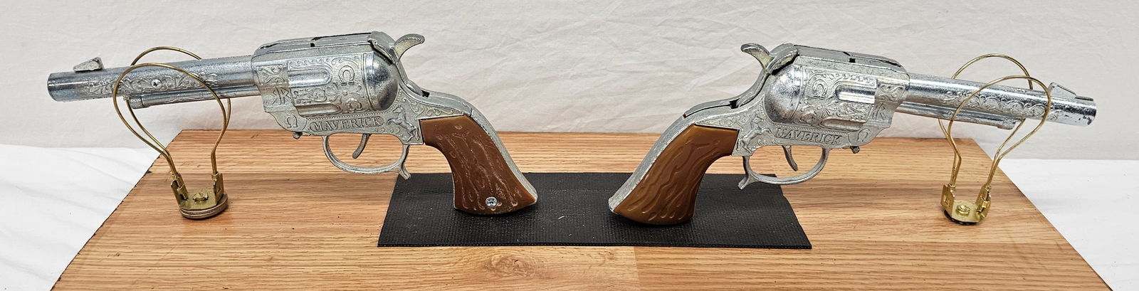 Pair of Maverick Cap Guns By Lonestar: Pair of Maverick Cap Guns By Lonestar in new old stock unfired condition. Collector grade examples.