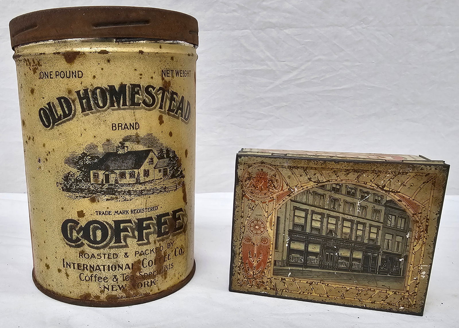 Hopjes Dutch Coffe Tin & Old Homestead Coffee Tin: Ealry Hopjes Dutch Coffe or Candy Tin from Hague, Netherlands & Old Homestead Coffee Tin, both are in as seen condition.