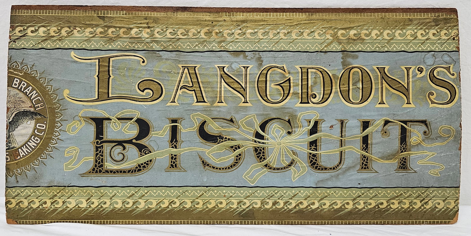 Langdon's Biscuit Wooden Advertising Sign: 1890's Langdon's Biscuit Wooden Advertising Sign. Size: 20" L x 9 3/4" T.
