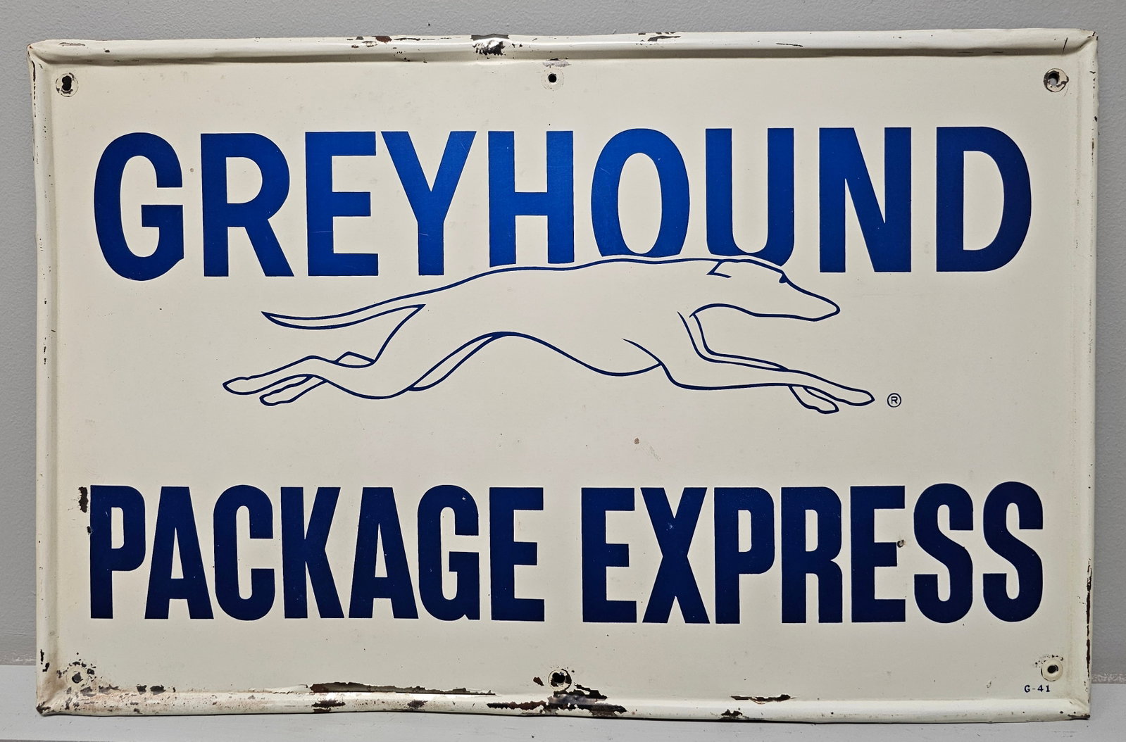 1941 Greyhound Bus Package Express Sign: Authentic 1941 Greyhound Bus Package Express (SSM) Sign marked G-41. Overall very nice original codition, C-7 range. Size: 27 5/8' x 17 5/8'