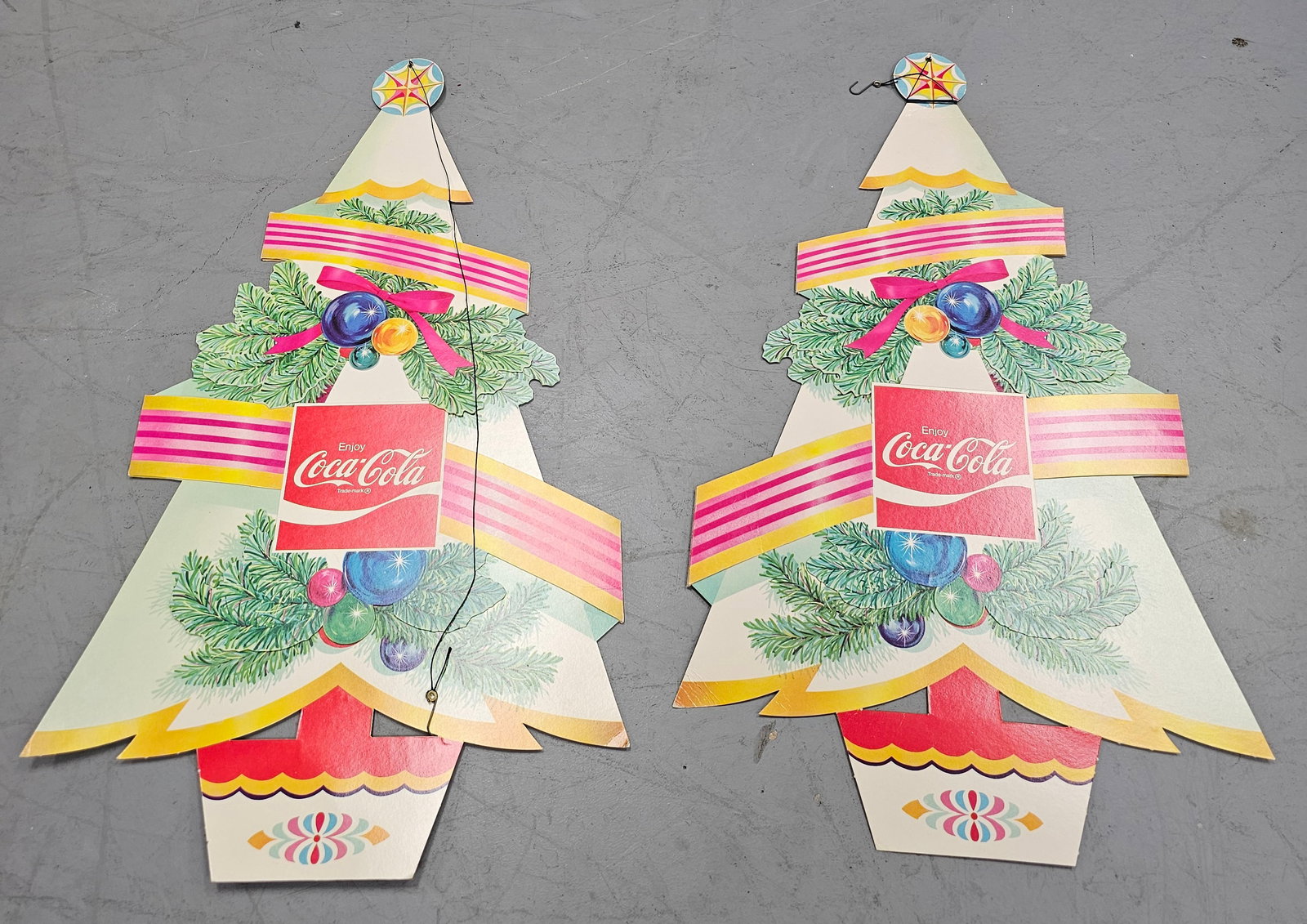 1960s Coca Cola Christmas Tree Cutouts: 1960s Coca Cola Christmas Tree Cutouts in original new old stock collector grade condition. Size: 24" T