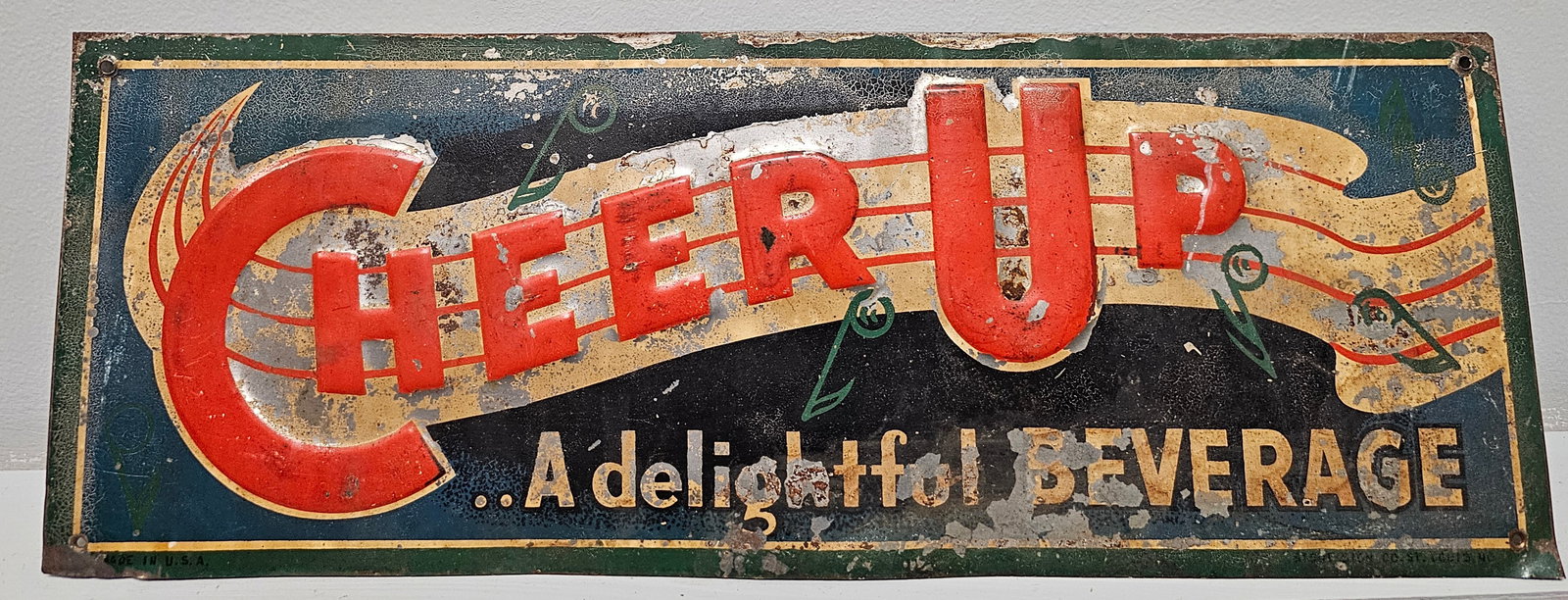 1940s Cheer Up Embossed Soda Advertising (SST) Sign: 1940s Cheer Up Embossed Soda Advertising (SST) Sign, in original state and made by the Stout Sign Company. Hard sign to find. Size: 19' x 6 7/8"
