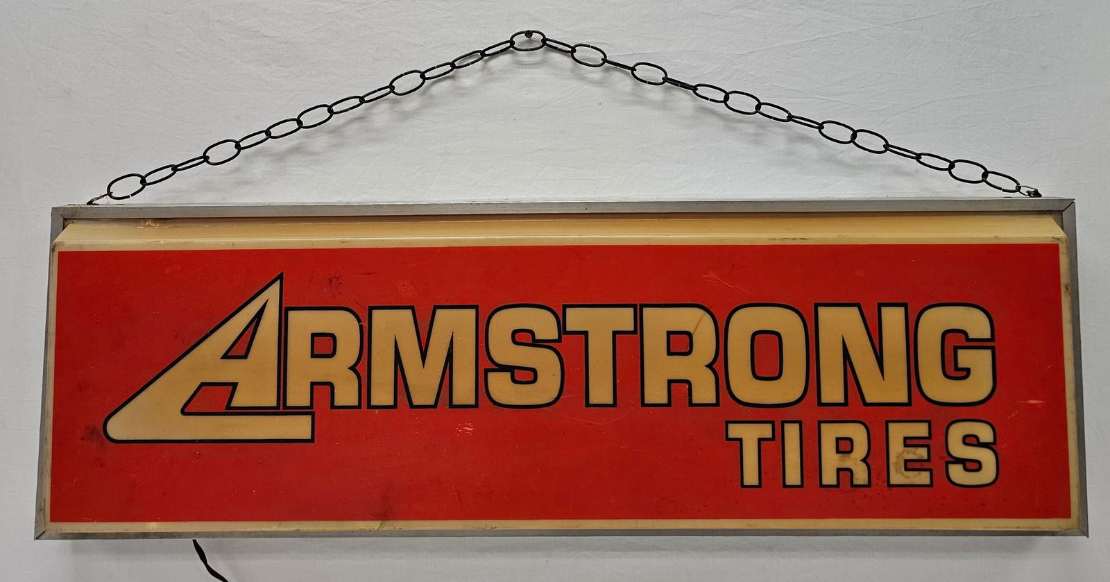 Armstrong Tires Light Up Advertising Sign: Armstrong Tires Light Up Advertising Sign in original state. Bulb is blown and will need replaced. Otherwise Good+ condition. Size: 38" L x 12" T x 4" D