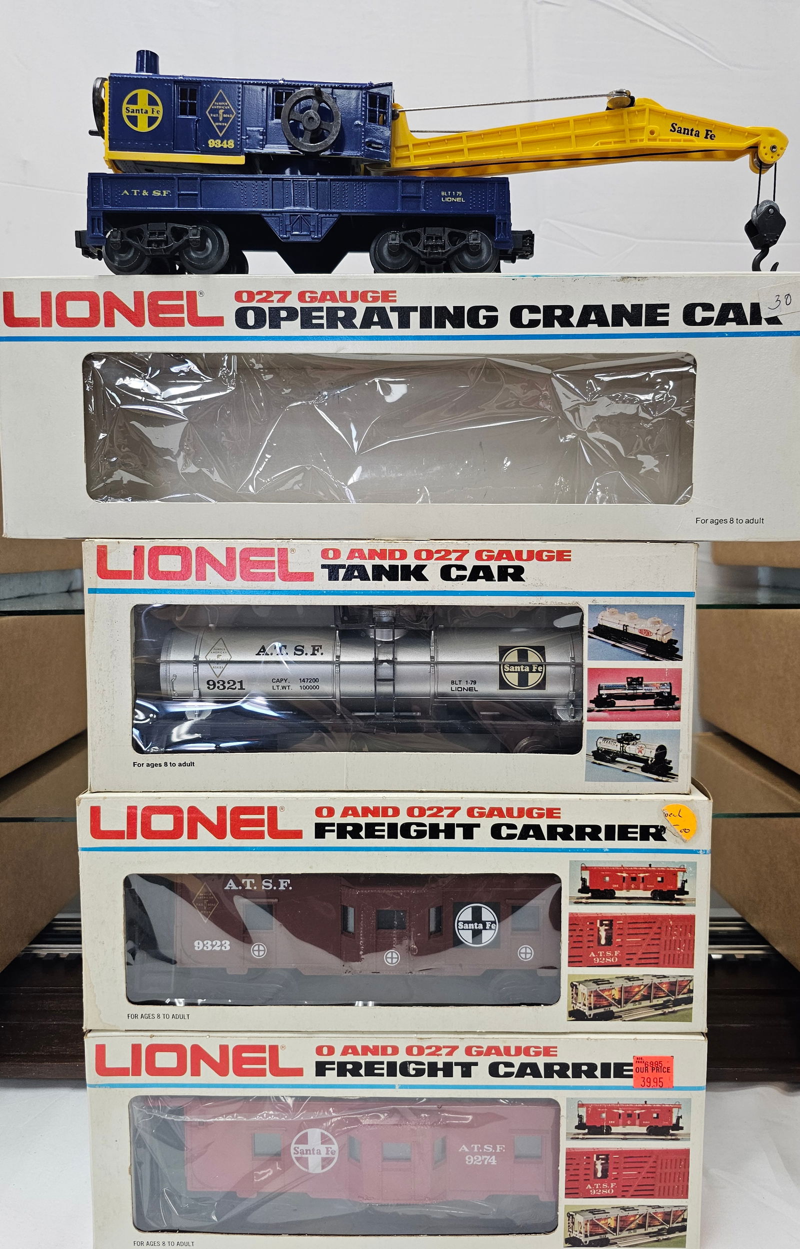 Lionel Santa Fe Rolling Stock Lot of 4: Lionel Santa Fe Rolling Stock Lot of 4 new in box C-10 Never been run. 1. 6- 9348 Crane Car. 2. 6-9274 Bay Window Caboose. 3. 6-9323 Famous American Railroad Series ATSF Caboose. 4. 6-9321 Famous Amer