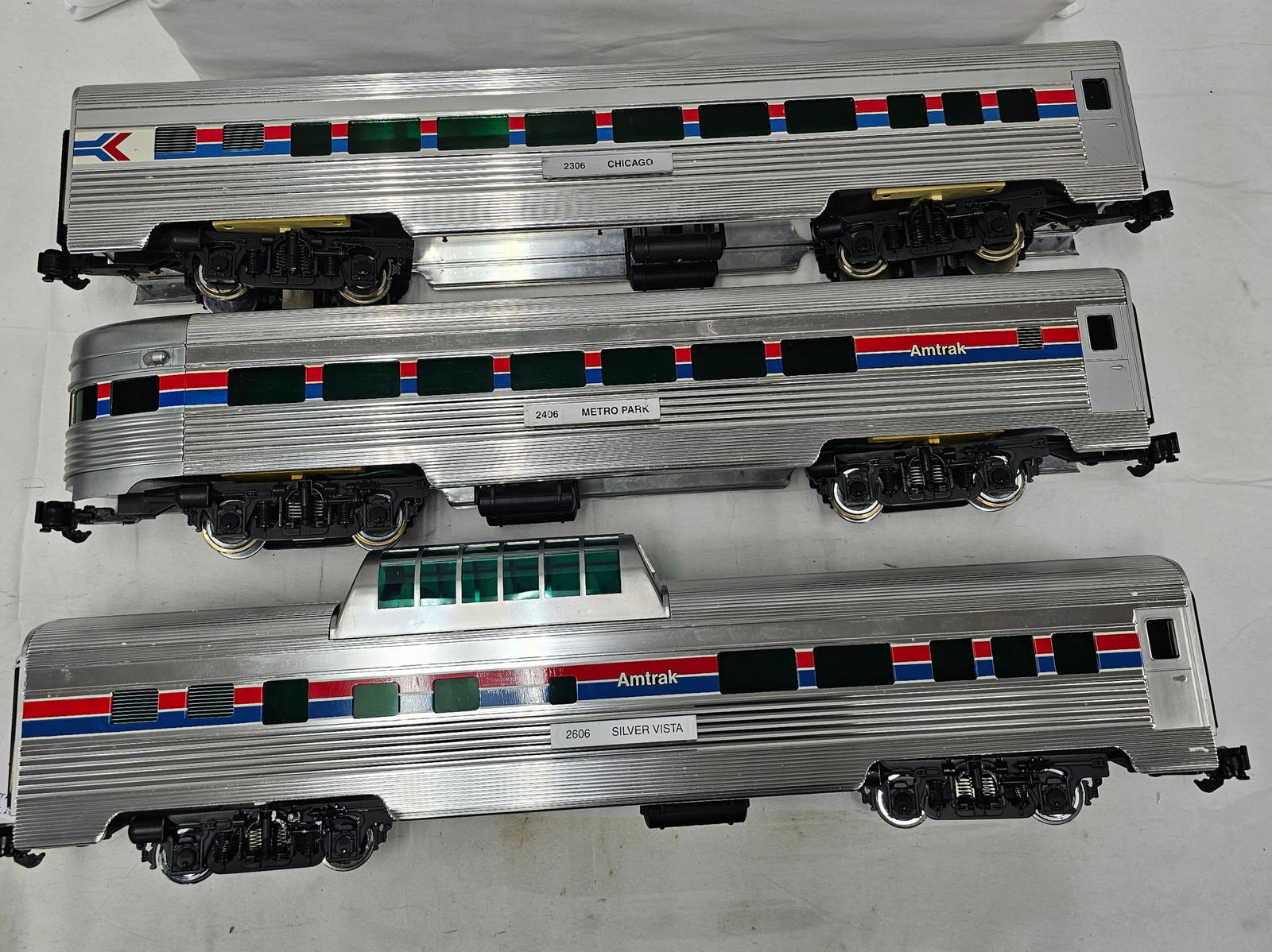 Aristo-Craft G-Scale Alum. Amtrak Car Lot of 3: Aristo-Craft G-Scale Aluminum Amtrak Passenger Car Lot of 3, C-8. 1. #2306 "Chicago" Passenger Car. 2. #2406 "Metro Park" Observation Car. 3. #2606 "Silver Vista" Vista Dome Car.