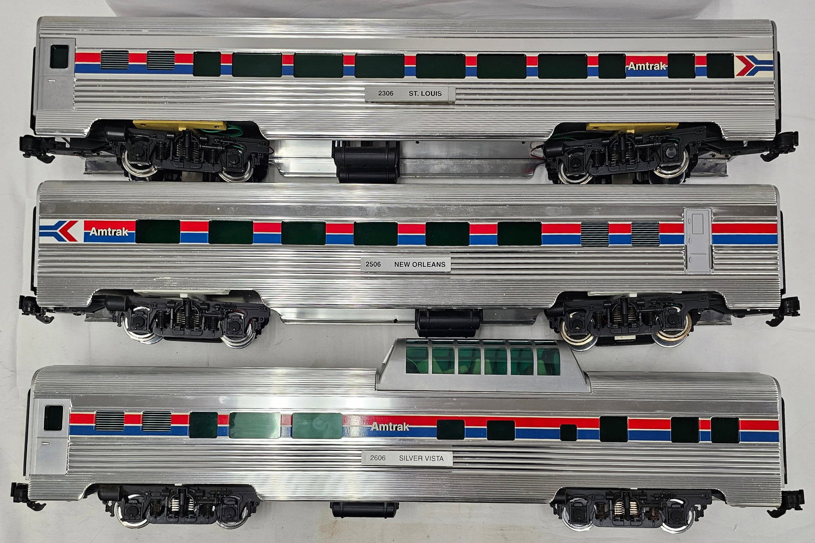 Aristo-Craft G-Scale Alum. Amtrak Car Lot of 3: Aristo-Craft G-Scale Aluminum Amtrak Passenger Car Lot of 3, C-8. 1. #2306 "St. Louis" Passenger Car. 2. #2506 "New Orleans" Diner Car. 3. #2606 " Silver Vista" Vista Dome Car.