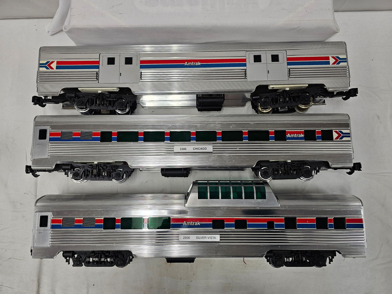 Aristo-Craft G-Scale Alum. Amtrak Car Lot of 3: Aristo-Craft G-Scale Aluminum Amtrak Passenger Car Lot of 3, C-8. 1. Baggage Car, C-9+, test run only, like new. 2. #2306 "Chicago" Passenger Car. 3. #2606 " Silver Vista" Vista Dome Car, has one red