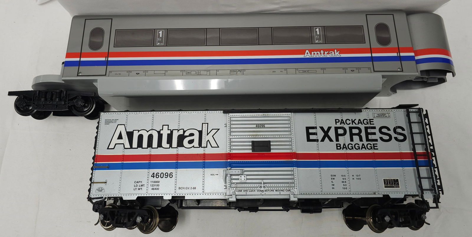 Aristo-Craft & LGB G-Scale Amtrak Lot of 2: Aristo-Craft & LGB Amtrak G-Scale Lot of 2, C-8+, little run time. 1. LGB #91953 Passenger Car. 2. Aristo-Craft Package/Baggage Express Amtrak Box Car.
