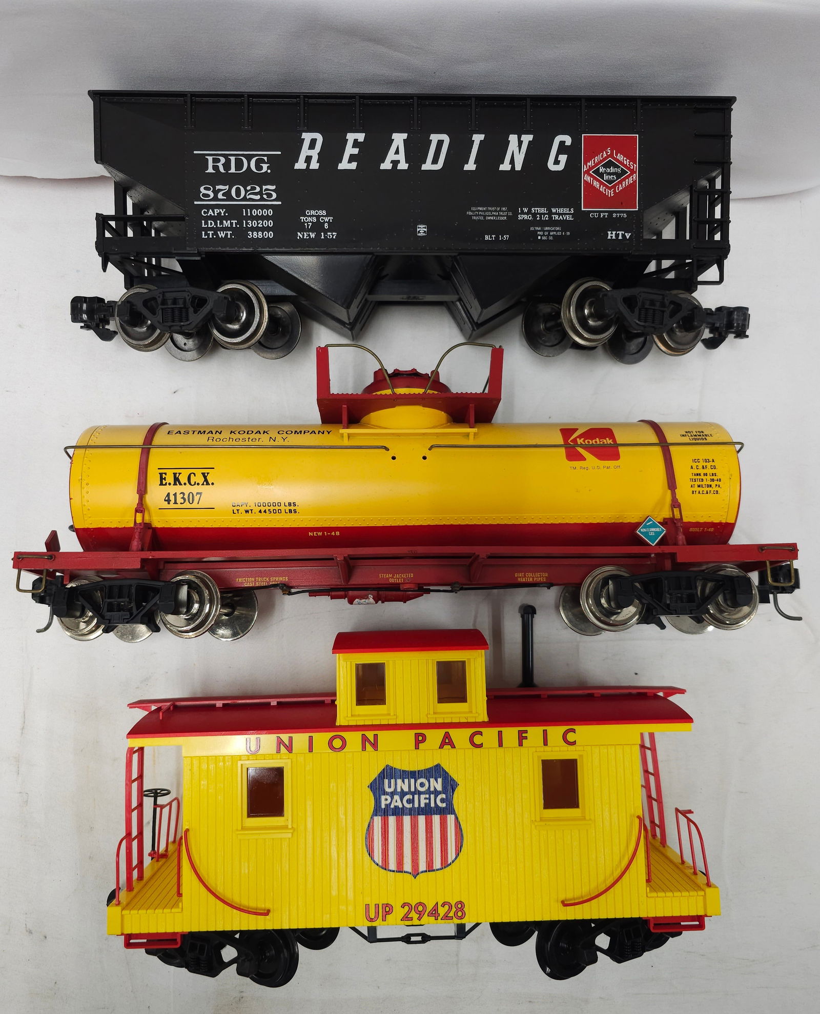G-Scale Rolling Stock & Caboose Lot of 3: G-Scale Rolling Stock & Caboose Lot of 3. 1- Reading 2 Bay Coal Hopper with Load, C-7+. 2- Kodak #41307 Tank Car, C-6. 3- Union Pacific #29428 Caboose, C-7+.