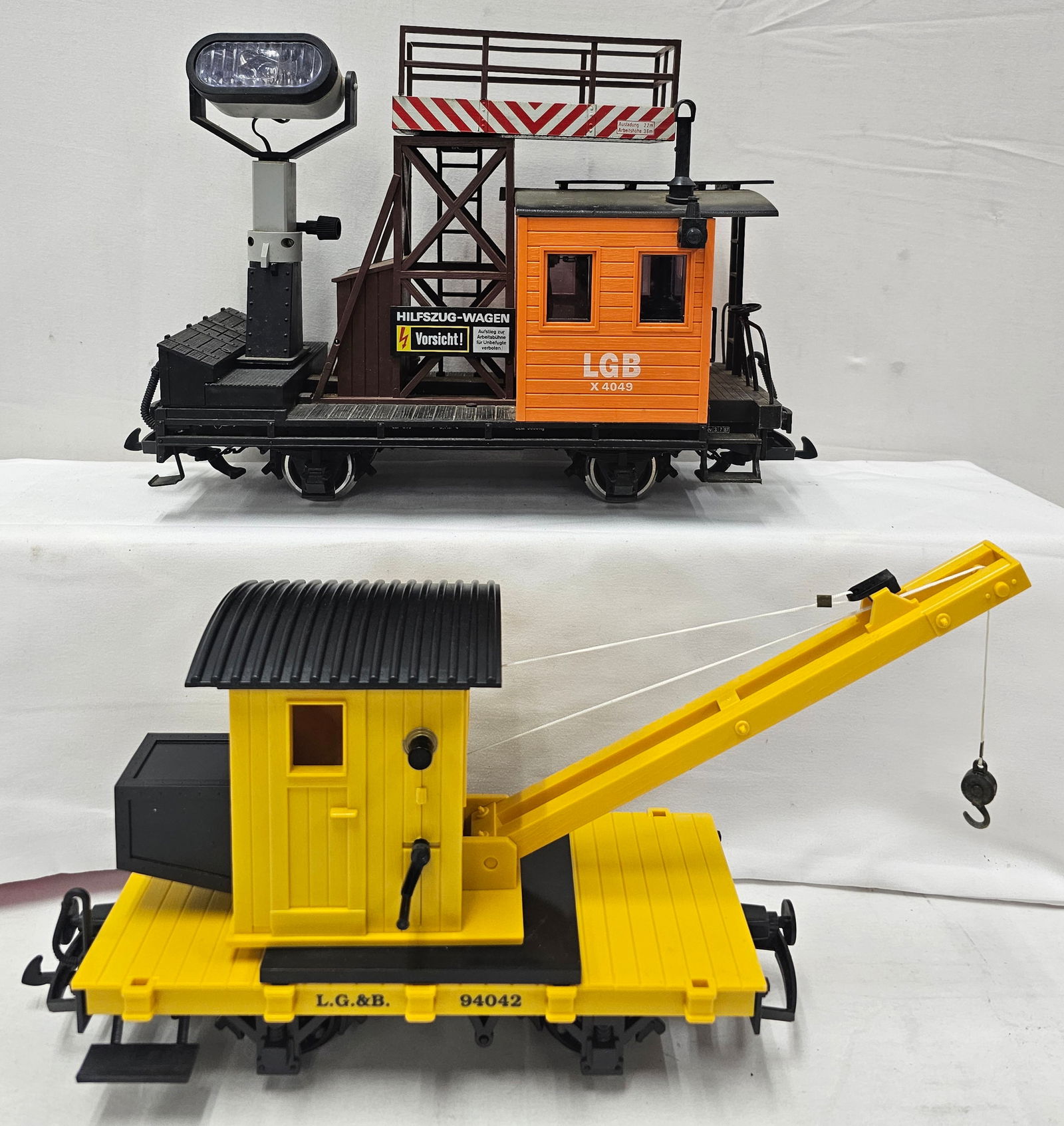 LGB G-Scale Freight Car Lot of 2: LGB G-Scale Freight Car Lot of 2, C-7+. 1. 4049 Maintenance & Search Light Freight Car, C-7 needs dusting. 2. 94042 Crane Car, C-8+, fully operational.