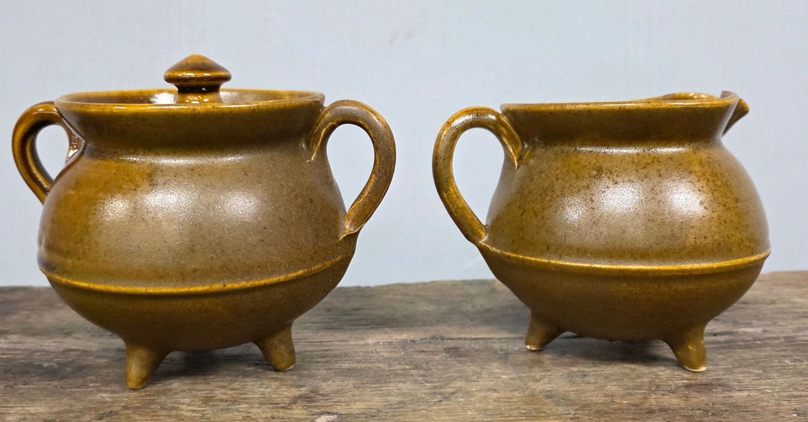 Signed WJ Gordy Mountain Gold Creamer & Sugar: Signed WJ Gordy Mountain Gold Creamer & Sugar footed and has one tiny glaze flake on the rim edge, no other damage or repairs. Standing: 3 7/8 Tall & 4 3/4" Tall with lid .