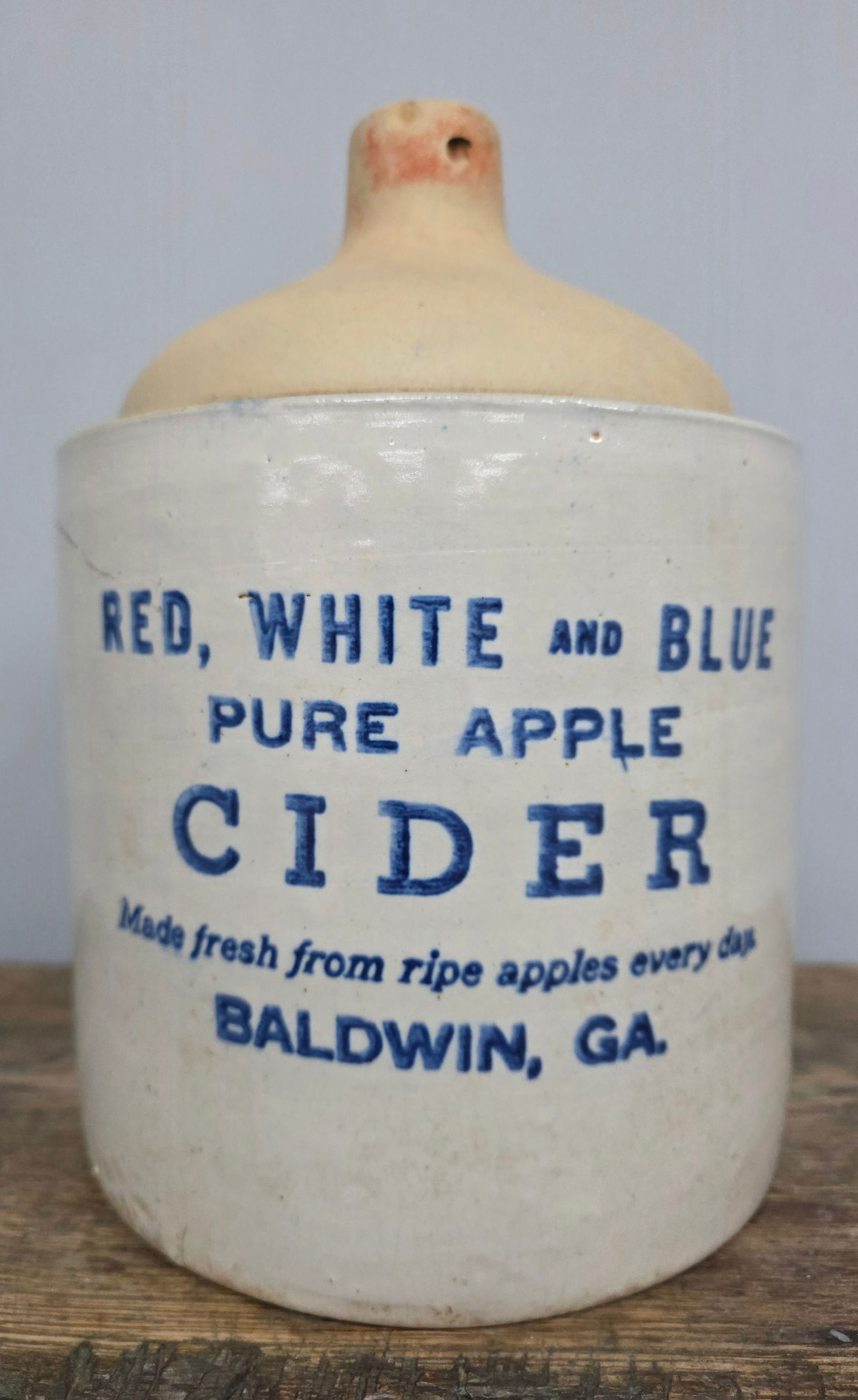 Red, White & Blue Pure Apple Cider Baldwin, Ga Jug: Red, White & Blue Pure Apple Cider Baldwin, Georgia advertising jug with cobalt stencil. Original red paint is missing from the top with one small lip flake and minor crazing lines in the Bristol glaz