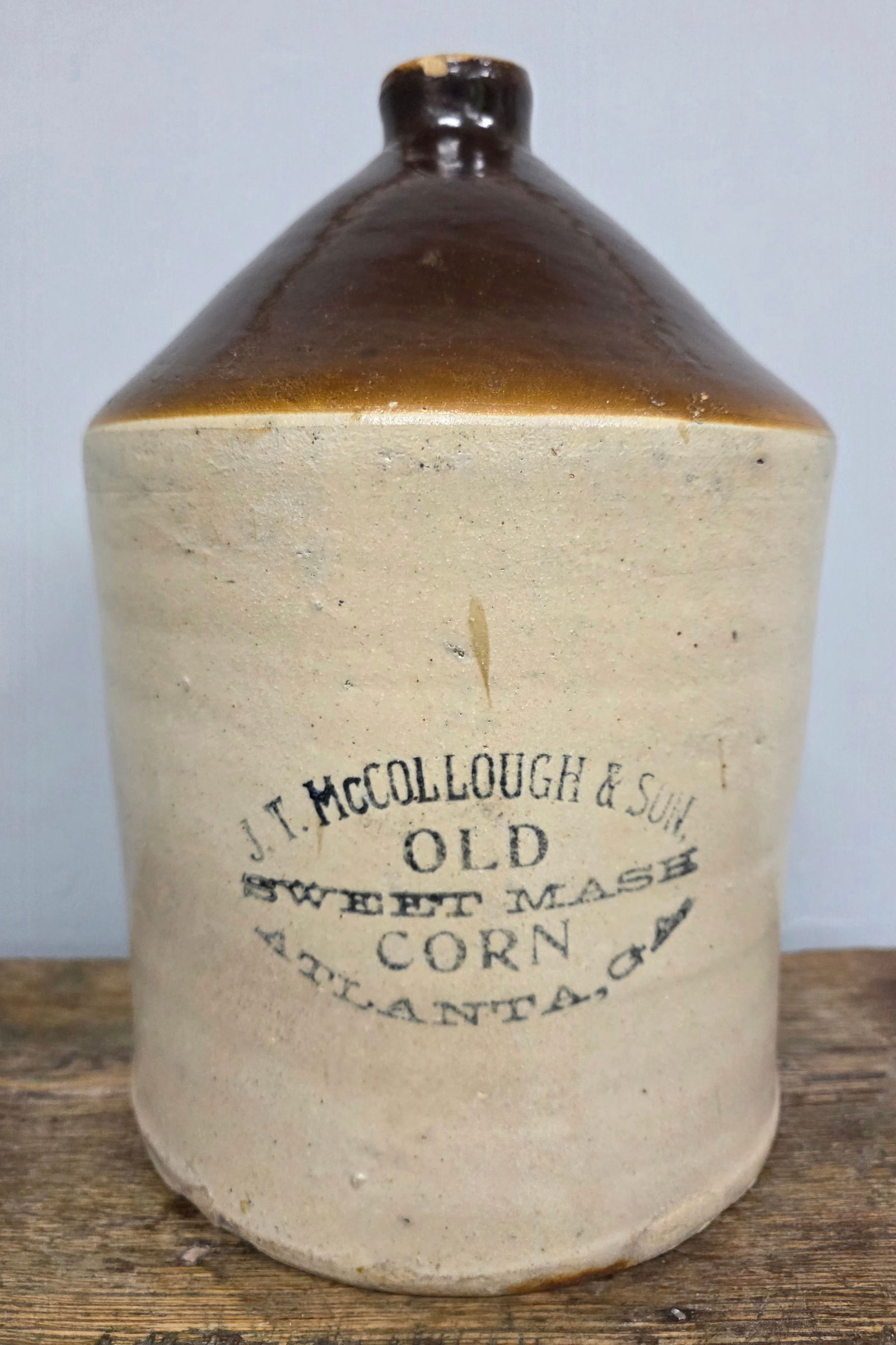 J T McCollough & Son Atlanta, Ga Whiskey Jug: Scarce J T McCollough & Son (Old Sweet Mash Corn) Atlanta, Ga Whiskey Jug with a strong stencil and a Bristol body and slip glaze top. This is a collector grade example even with a firing crack on the